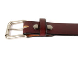 Cognac brown leather belt with two snaps, a removable silver buckle, and a belt loop.